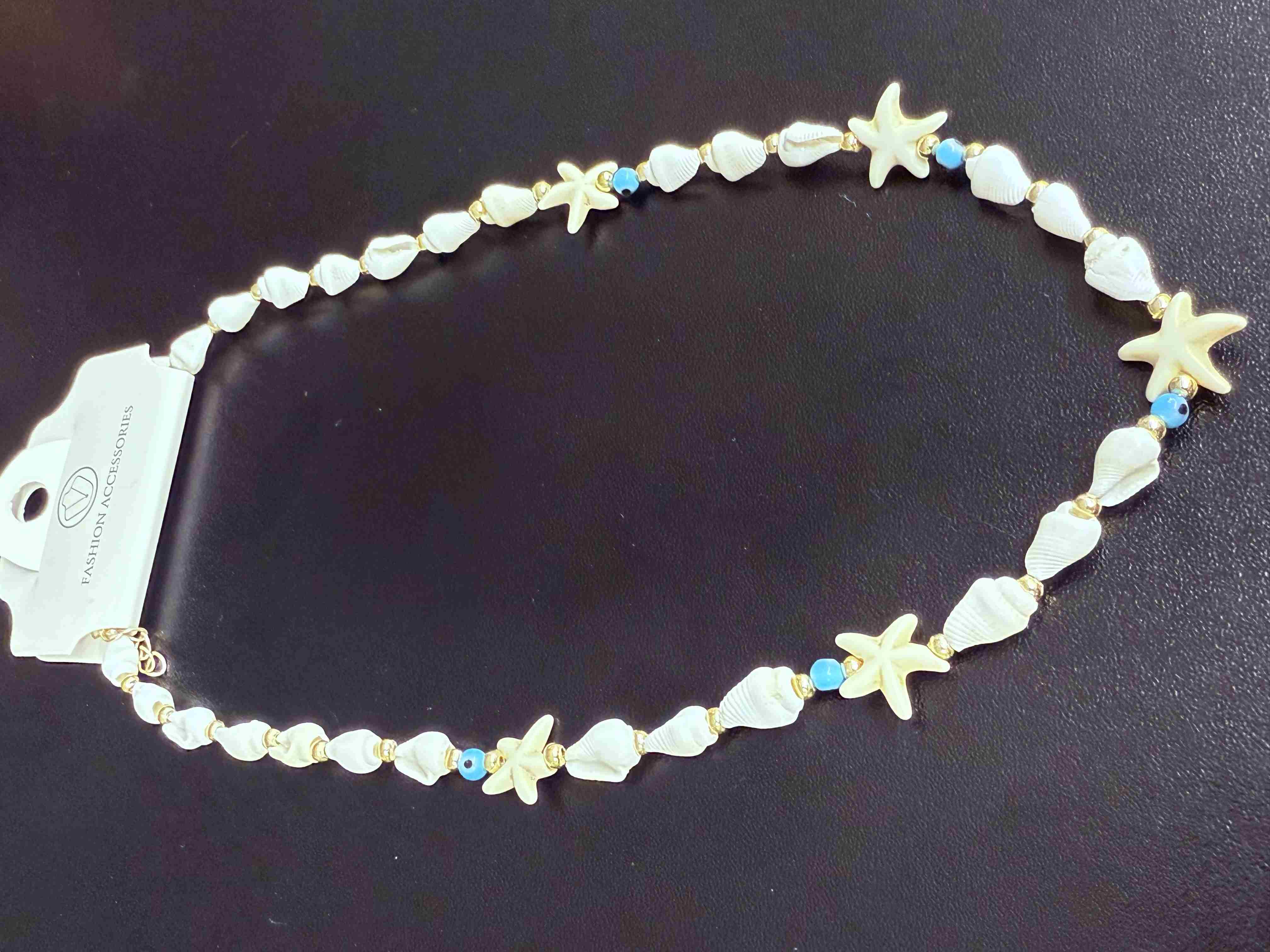 Deniz kabuğu kolyesi