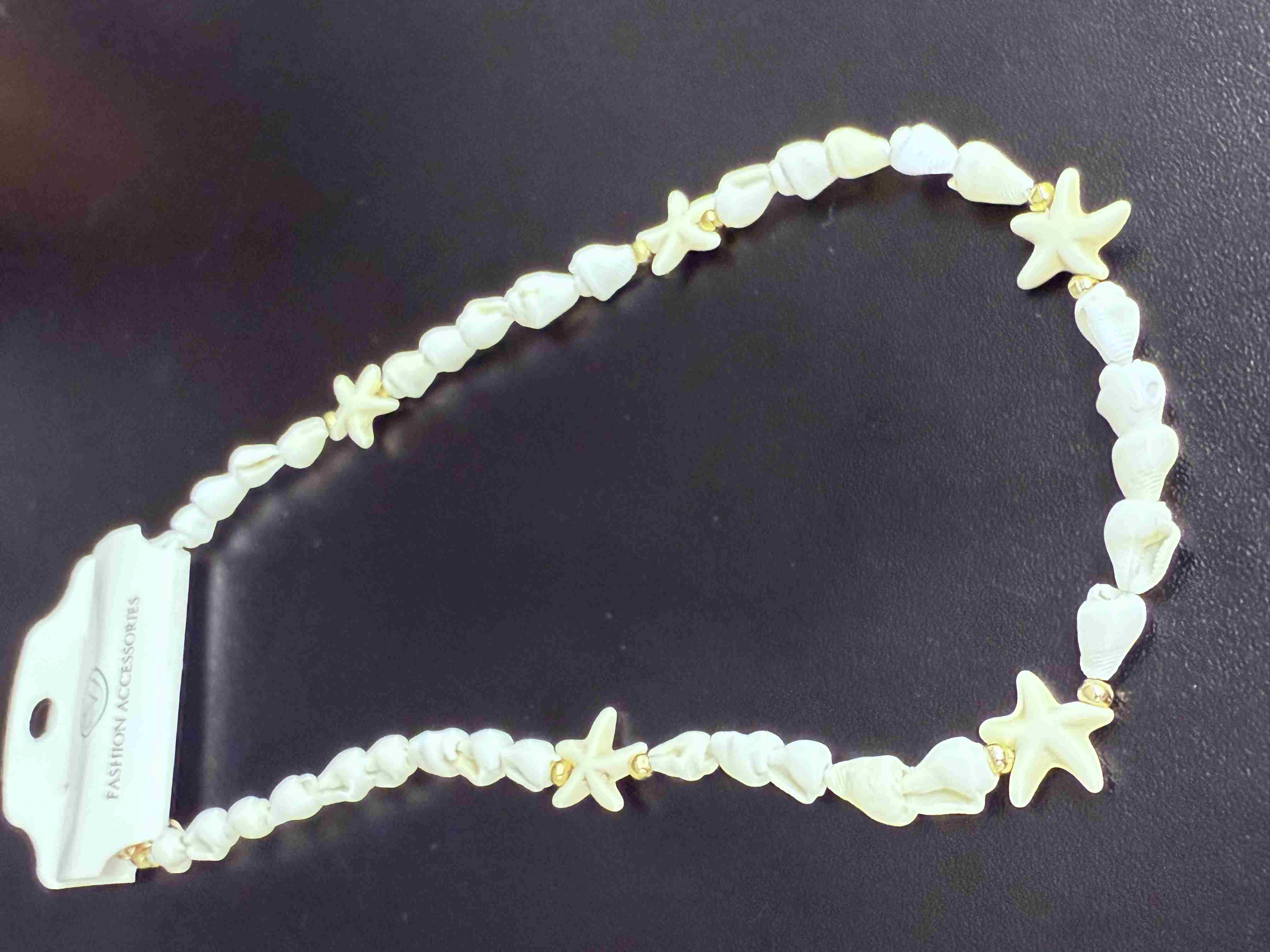 Deniz kabuğu kolyesi