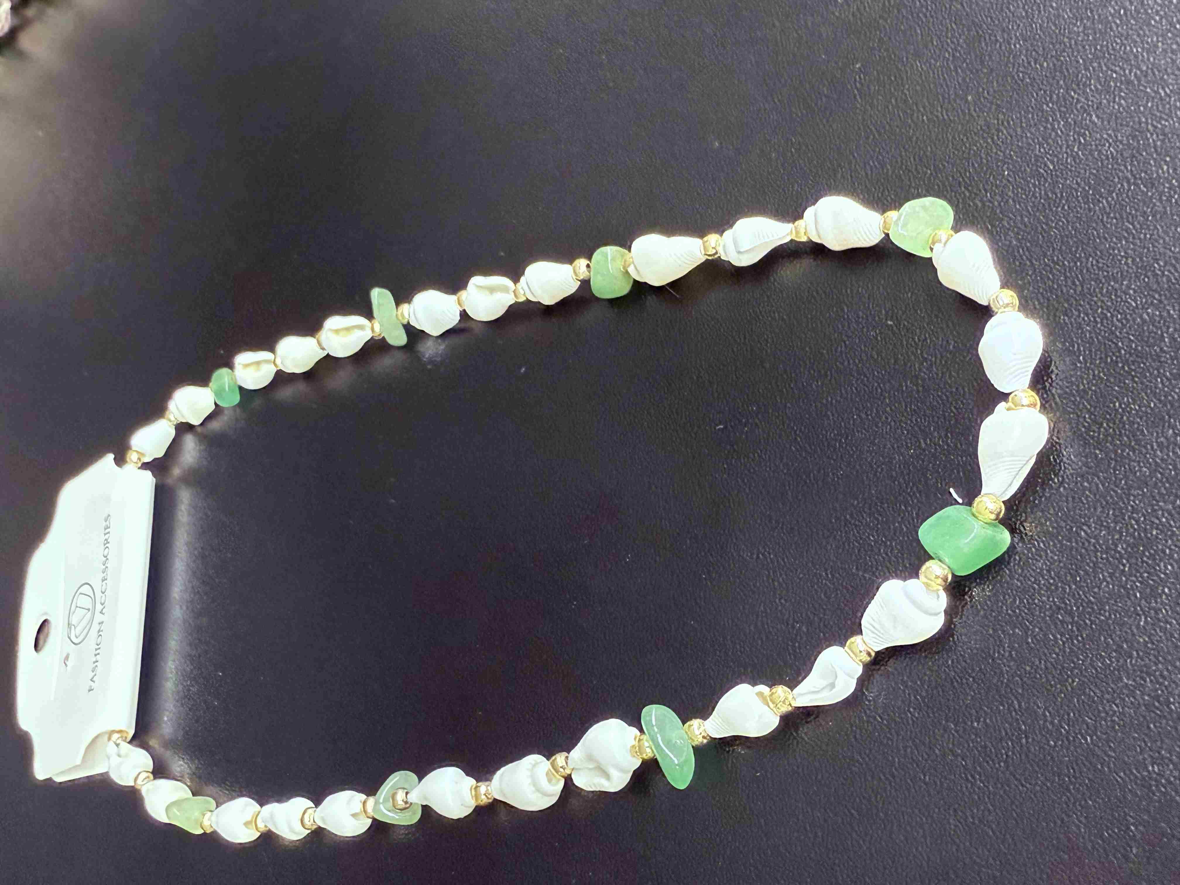 Deniz kabuğu kolyesi